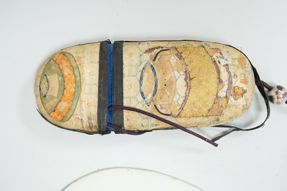 A Chinese embroidered spectacles case and an armorial oval miniature dish